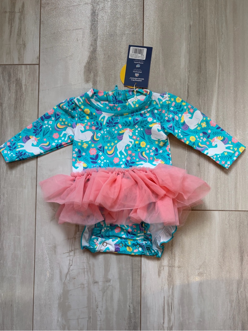 NWT RuffleButts Colorful Aqua Unicorn Meadow Tutu Rash Guard Swimsuit Girls 0-3M
